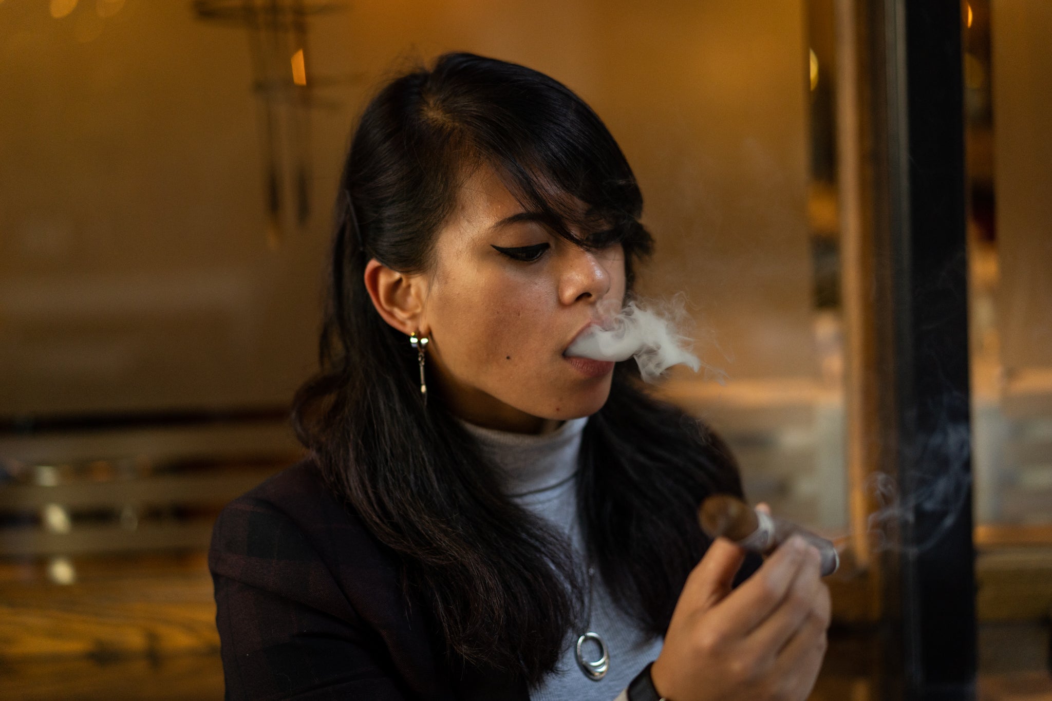 Syafiera Rosidi smokes an EGM Cigar