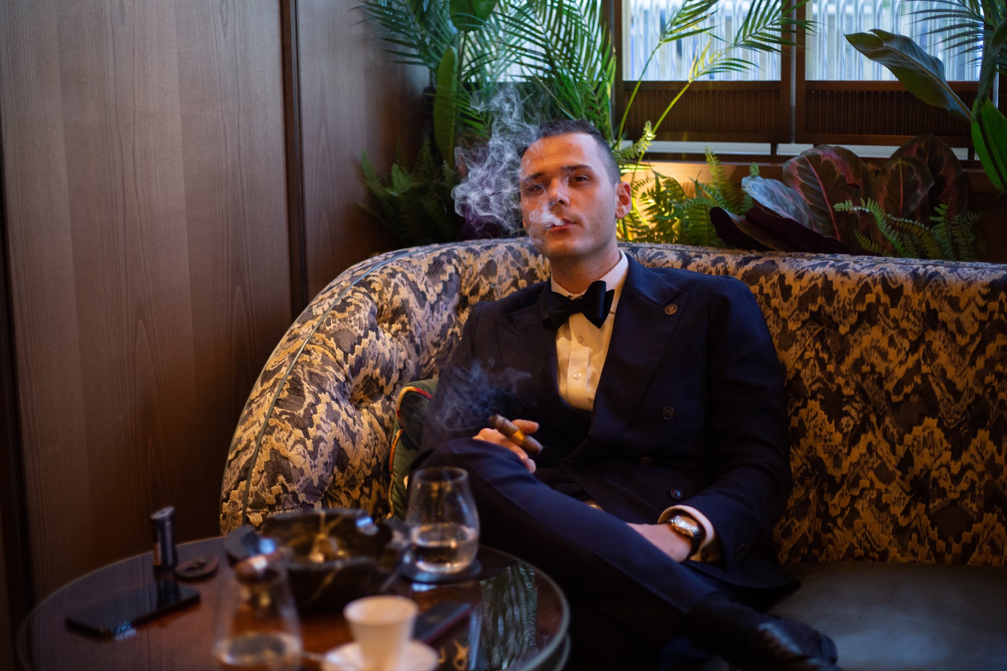 Giuliano Santilli enjoys a cigar at Oscuro, The Arts Club.