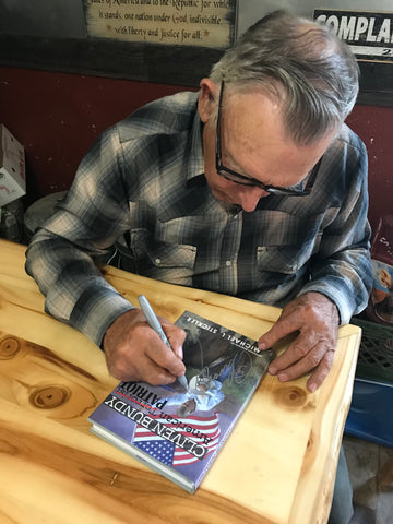 Cliven Bundy Signing some books for friends