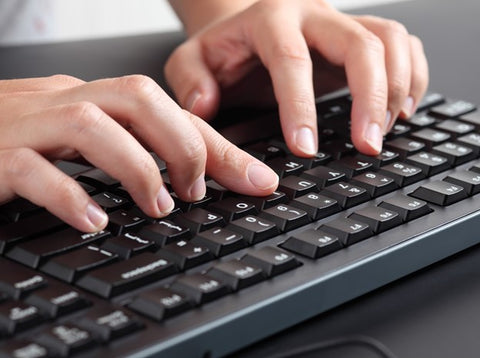 Person Typing on the Keyboard