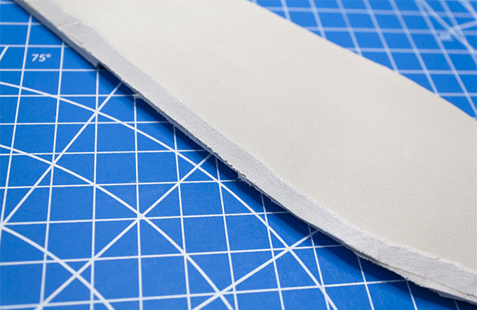 a cut piece of eva foam with a beveled edge