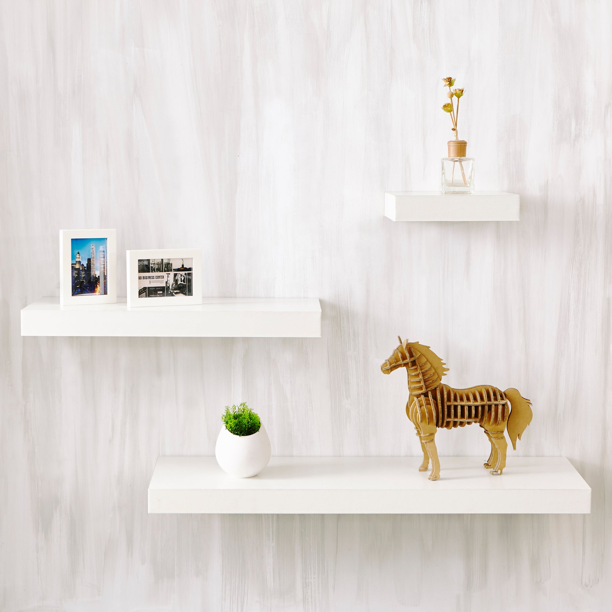 white wall shelves unit