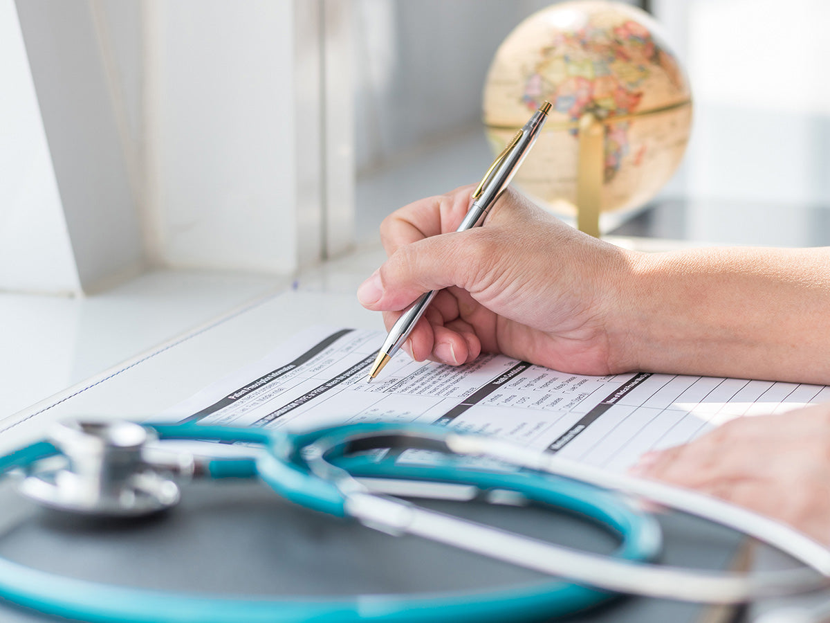 Image of a doctor looking at an insurance document