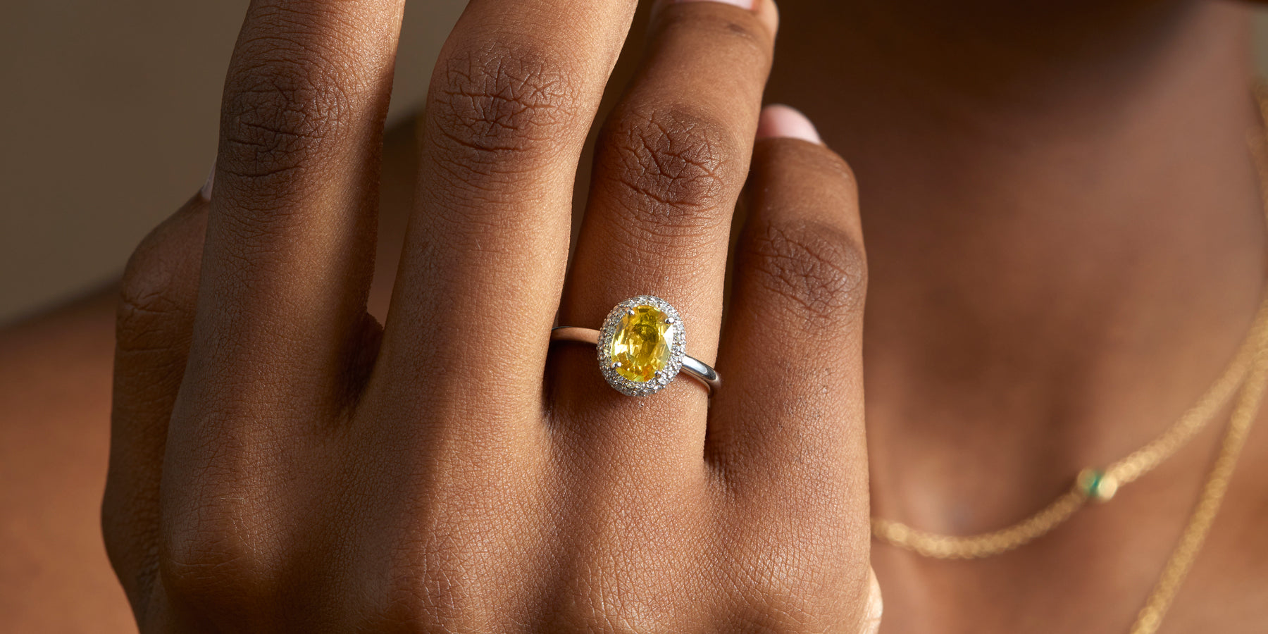 Yellow Sapphire oval cut Vintage engagement ring from Fenton worn on hand | 5 reasons why we love Gemstones over Diamonds with Fenton 