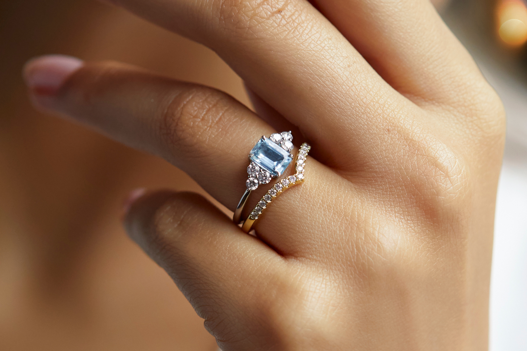 Aquamarine emerald cut Trefoil engagement ring from fine jeweller Fenton