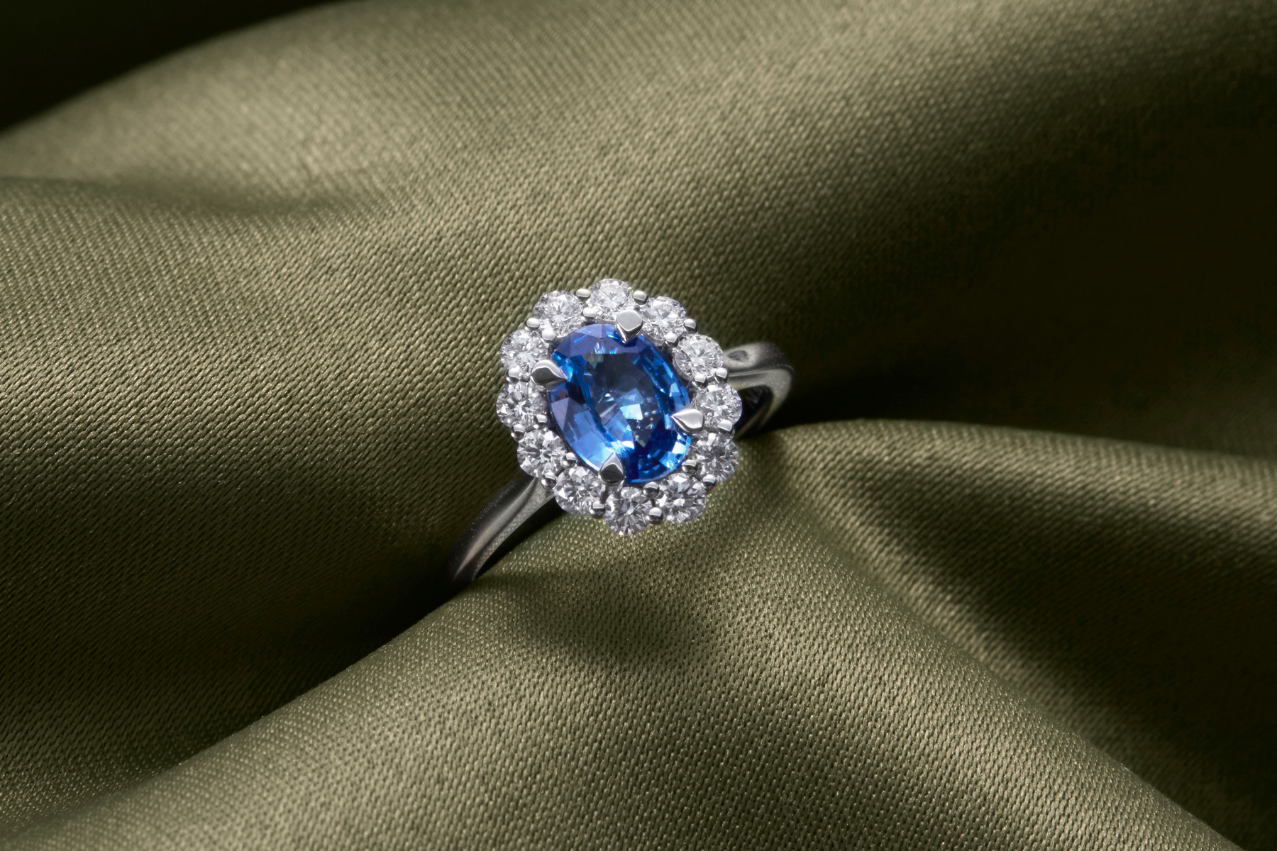 Blue Sapphire and Diamond cluster engagement ring from Fenton