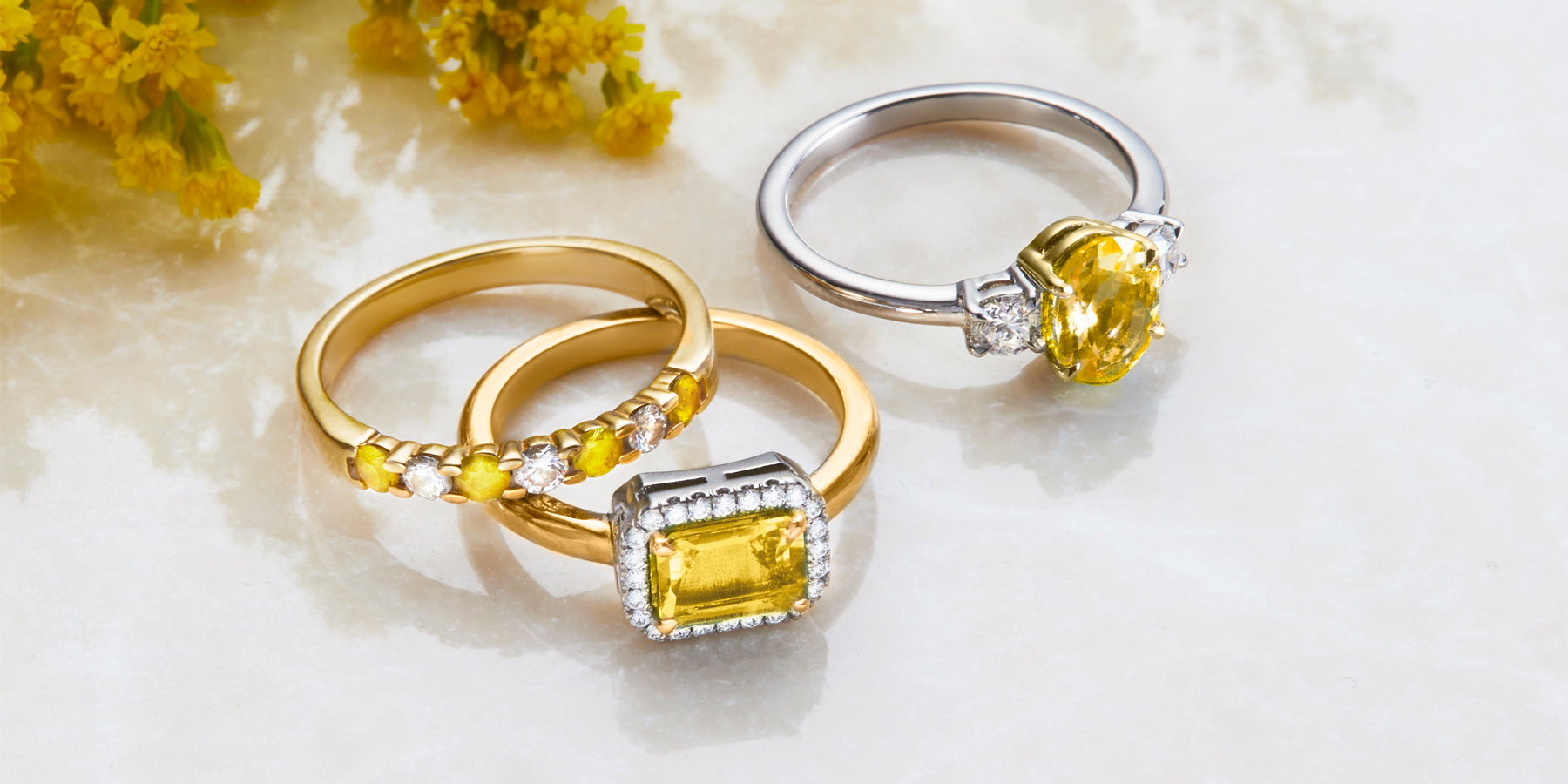 Guide to Sapphires featuring Yellow Sapphire 18k Gold and Platinum Rings from Fenton Jewellery