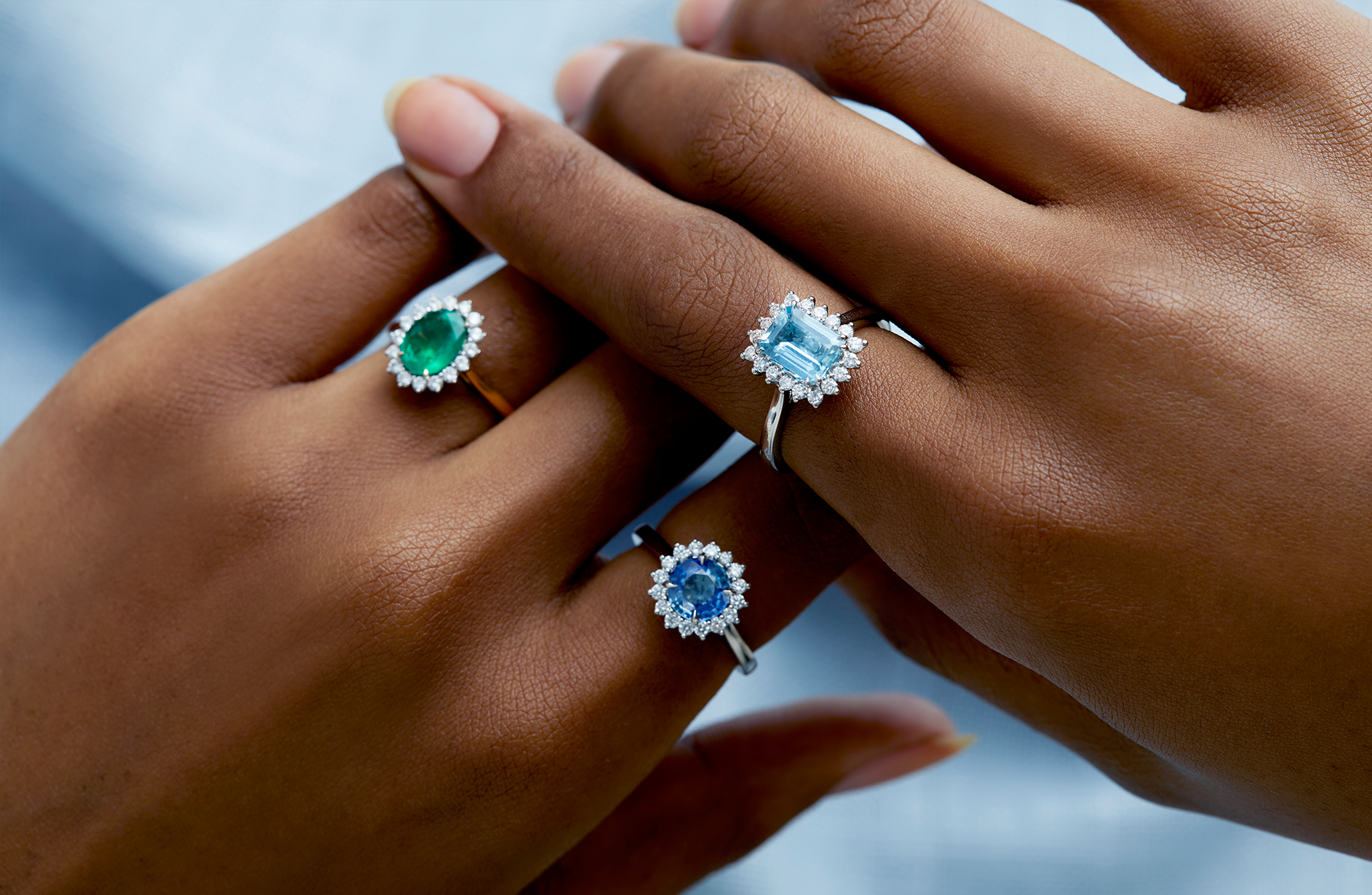 The Star Rings from Fenton - emerald, blue sapphire and aquamarine set in 18kt gold and platinum with a halo of diamonds. 