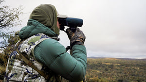 man outside in hunting vest