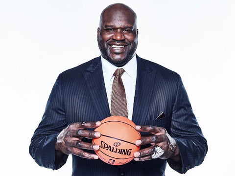 shaquille o'neal aka shaq holding a basketball