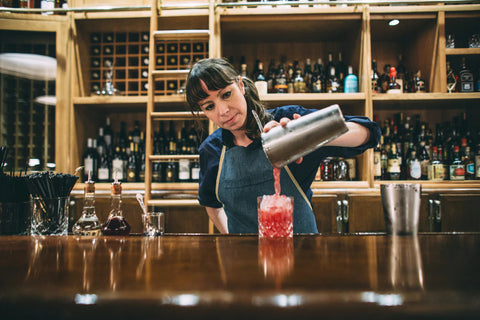 Bar tender wearing a Stock MFG. uniform