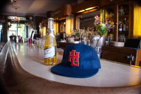 Miller High Life beer bottle and custom Miller High Life baseball hat made by Stock
