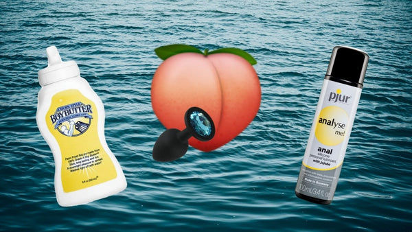 Anal lubes with peach and butt plug with an ocean background