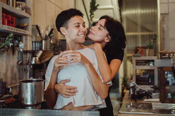 couple flirting in a kitchen by ketut subiyanto on pexels