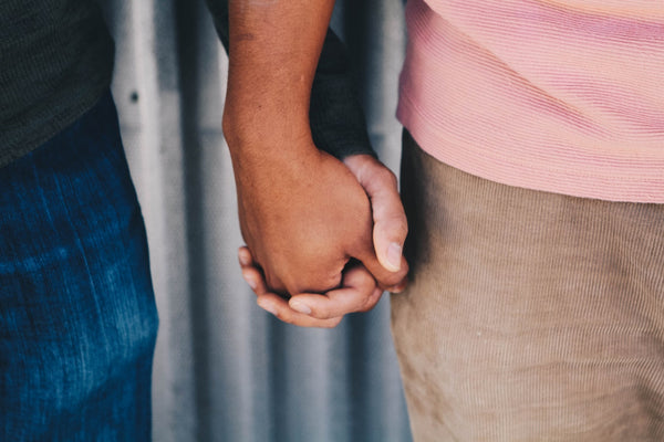 Couple holding hands