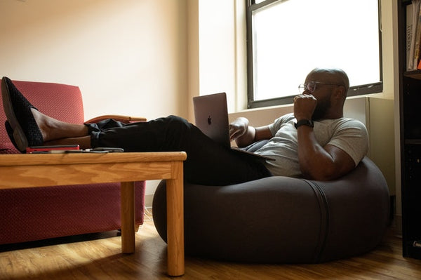 man watching on his computer