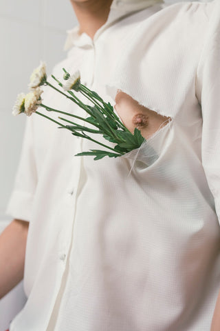 Flowers in shirt showing nipple