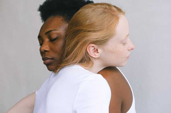 two women embracing affectionately