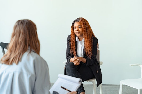 woman sitting with a doctor