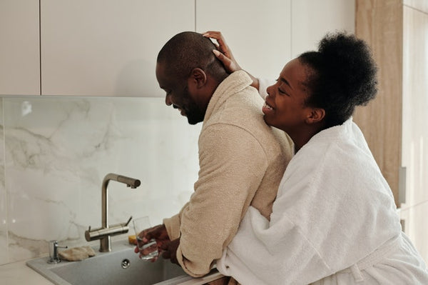 couple cuddling in the kitchen