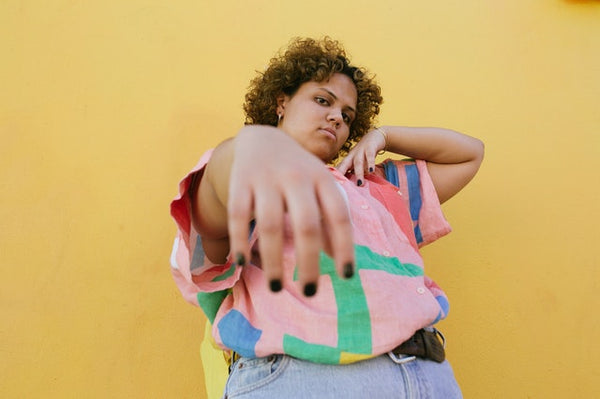 playful chubby woman in colorful shirt