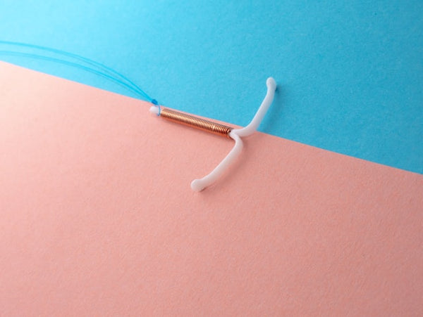 IUD on blue and pink background