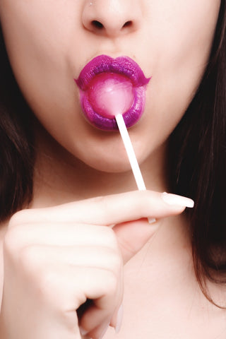 Woman with lollipop