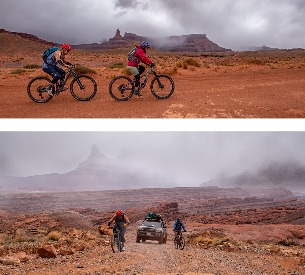 Mountain bikers climb into the mist and rain on Lockhart Basin Trail near Moab, Utah