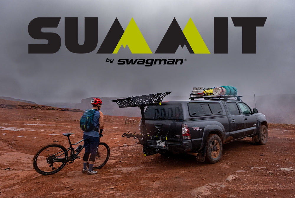 A Mountain Biker gets ready to load his mountain bike onto the Swagman Summit on the back of a Toyota Tacoma at the top of Hurrah Pass near Moab, Utah