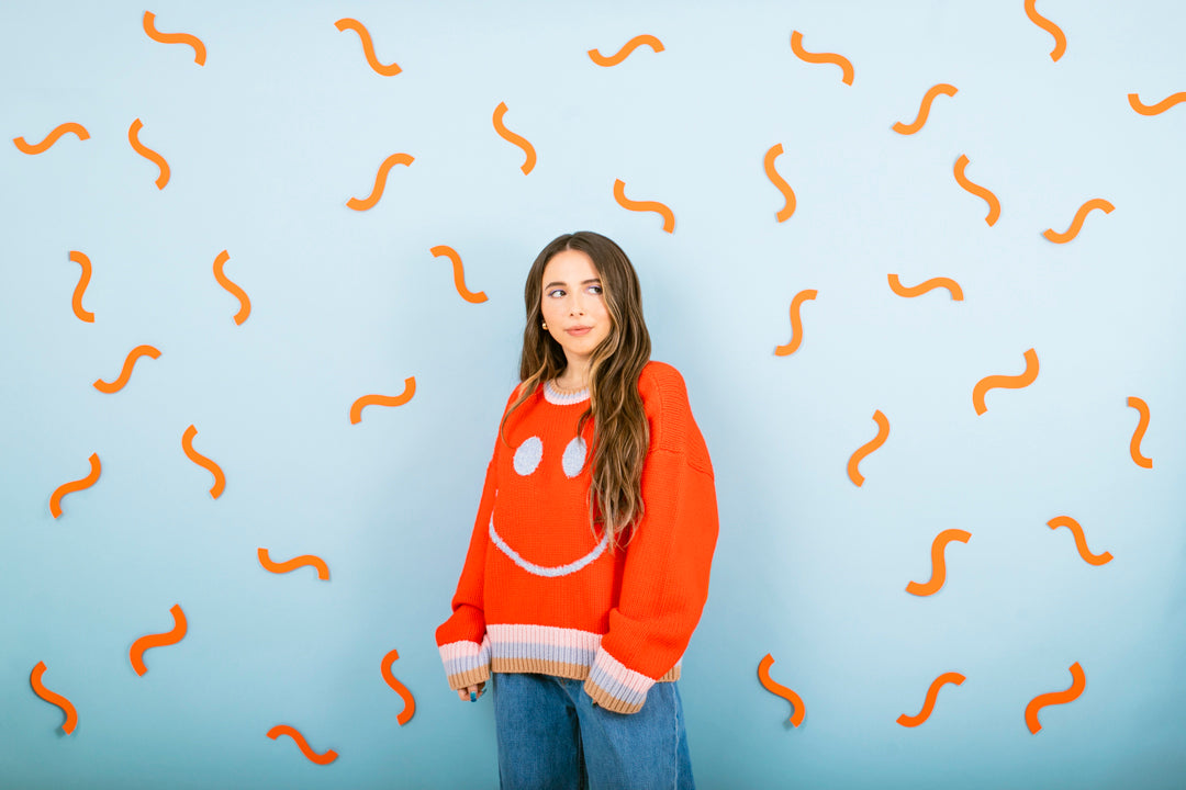 Esther Povitsky wearing JoosTricot Tomato Smiley Crew Neck 