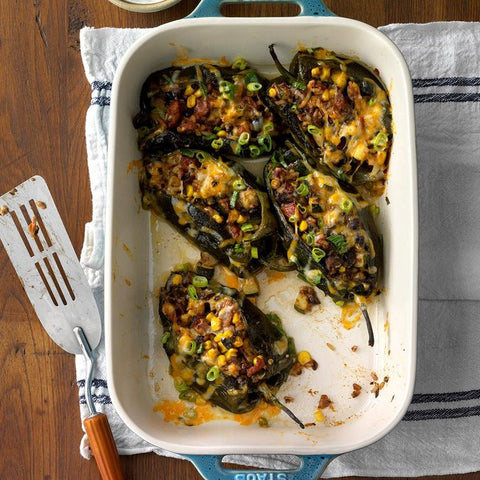 casserole dish containing fiery stuffed poblanos