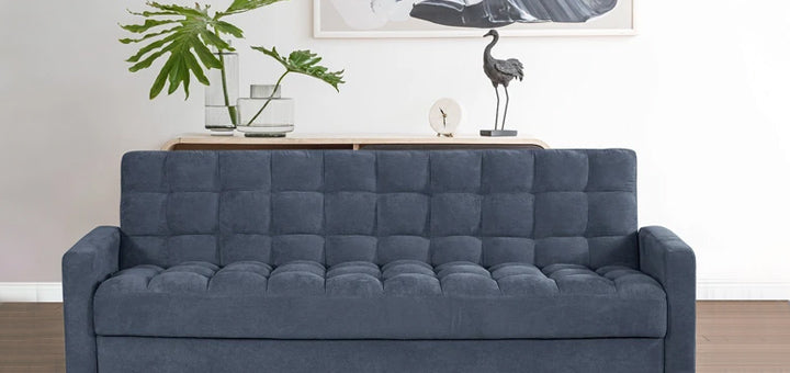 sofá cama color azul en sala blanca