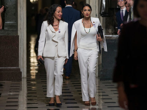 AOC in the white cape blazer