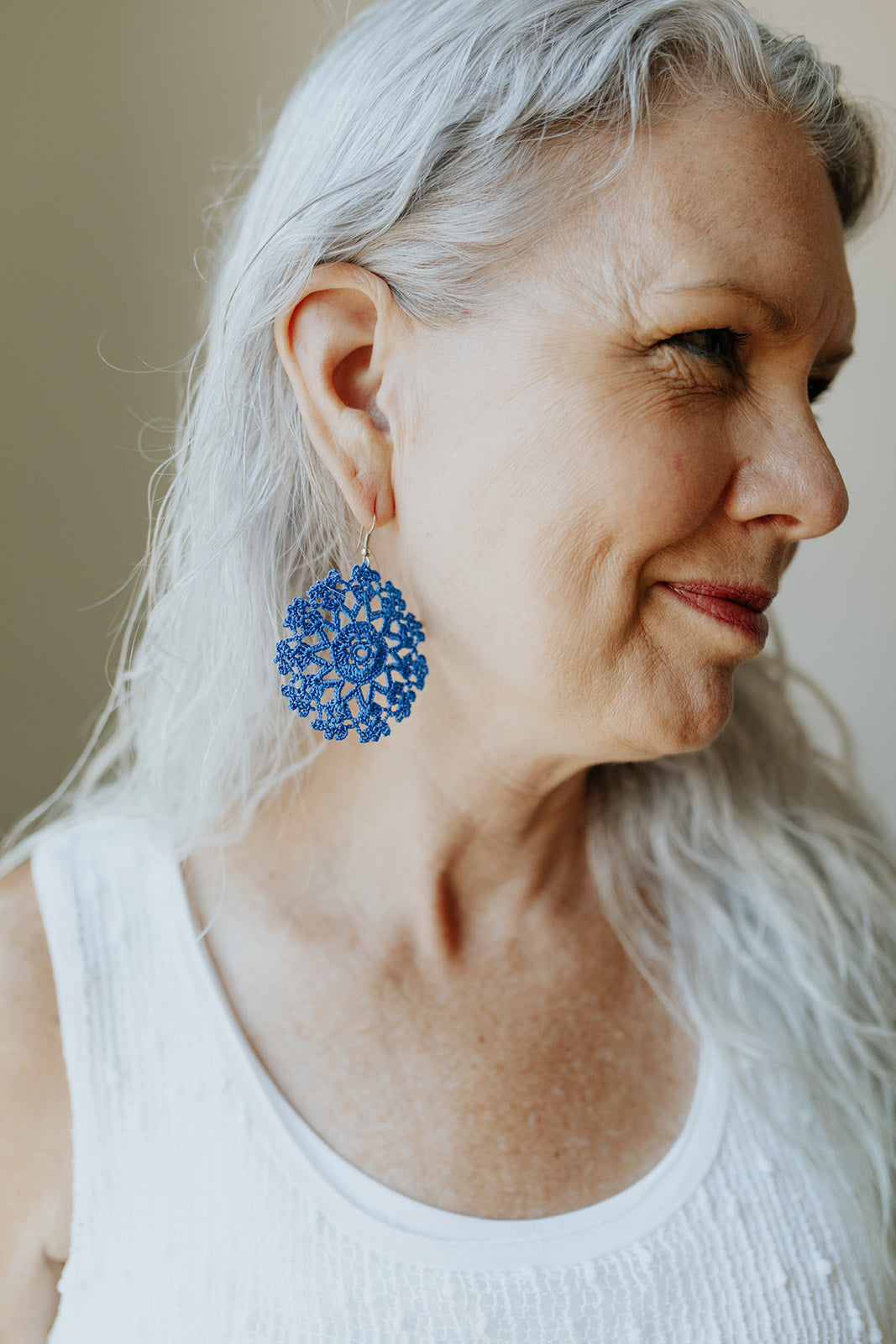 Woman wearing KISA Crochet Earrings in Blue