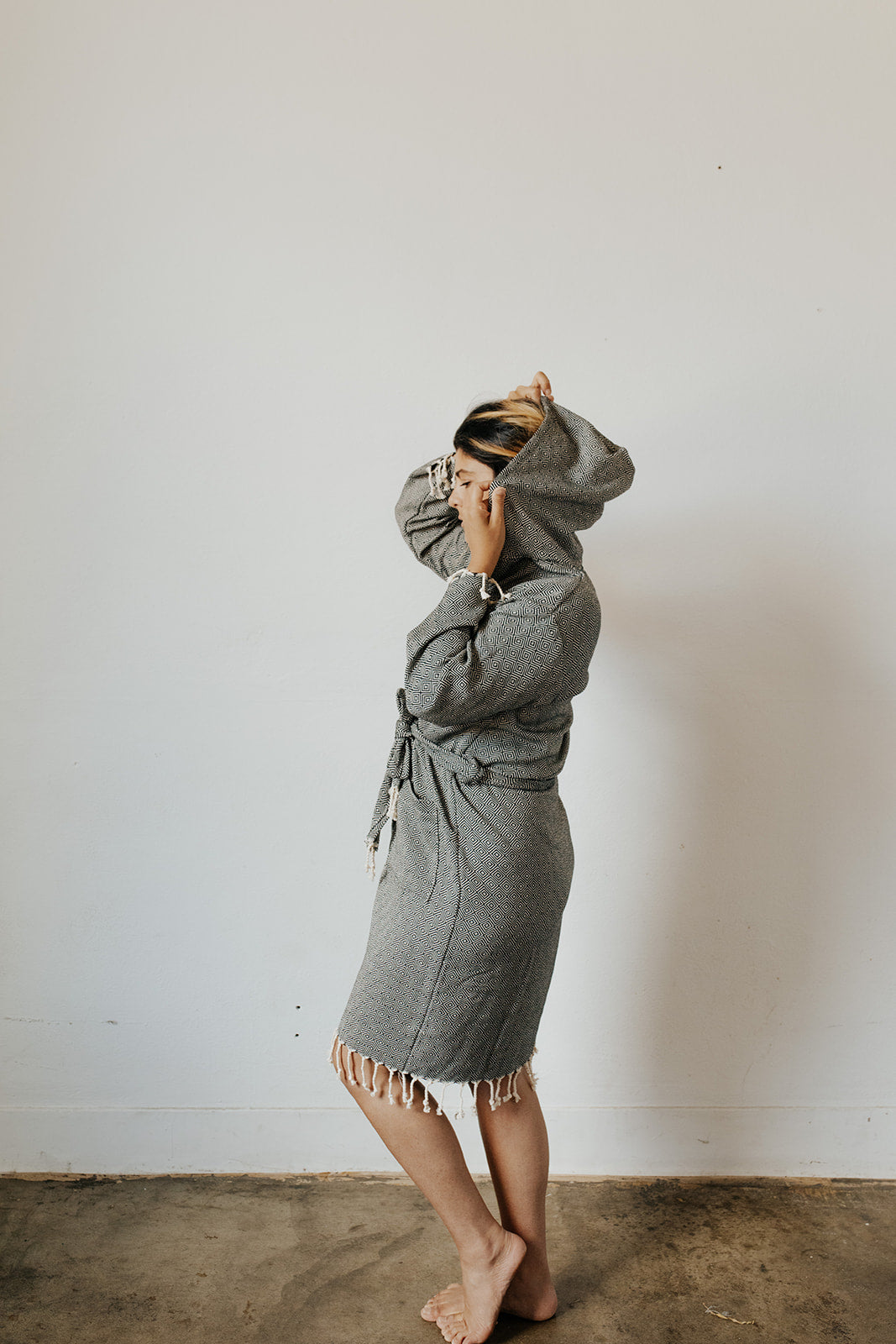 Woman wearing the Diamond Bathrobe in Charcoal