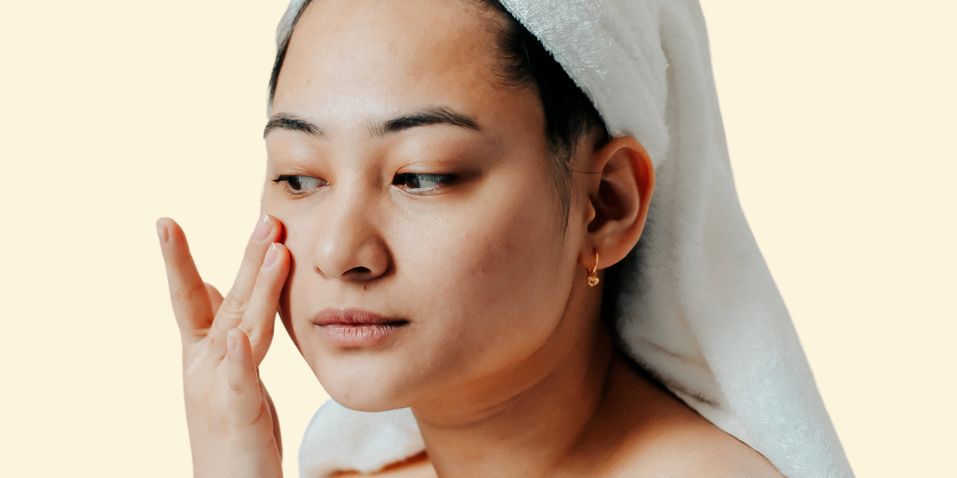 Woman applying a retinol to fight fine lines and wrinkles, pigmentation, dullness and acne scarring. Vitamin A Corrector. 