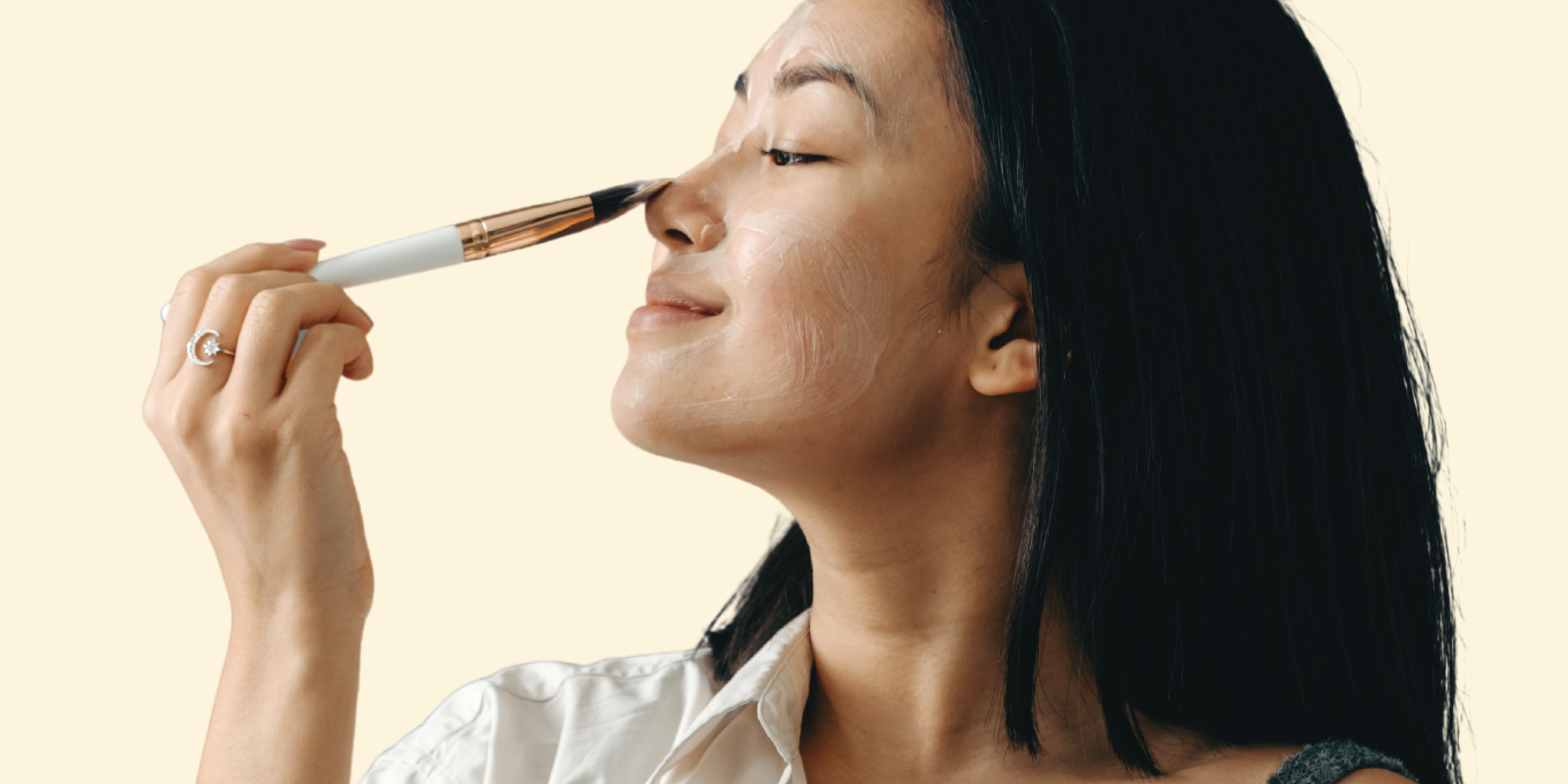 Woman applying a cosmeceutical cream mask to hydrate, clear and revitalise her skin.