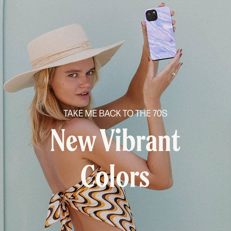 Woman in hat taking selfie with phone, text overlay about vibrant colors.