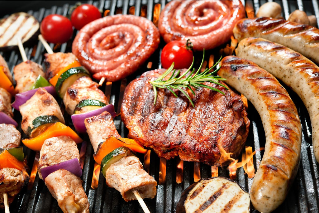 Sausage, chicken, veggies, meats grilling on wood pellet grill