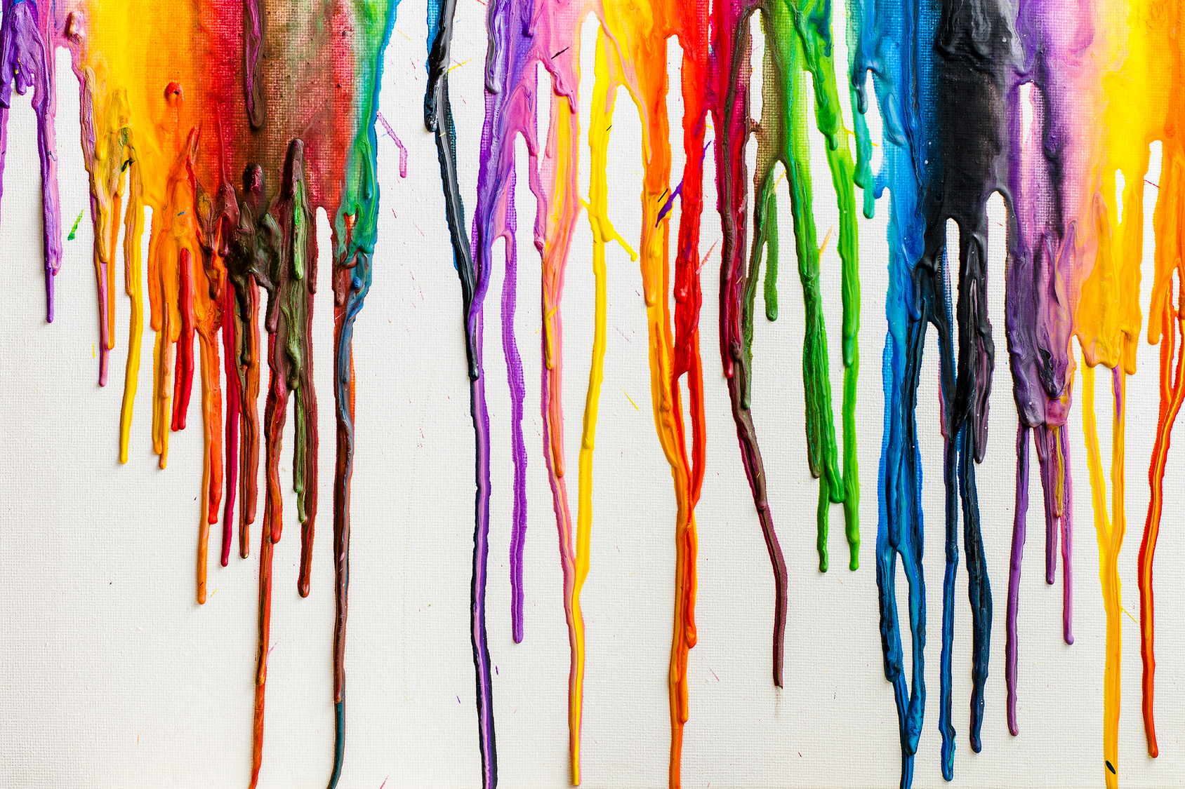 colourful crayons melted in canvas