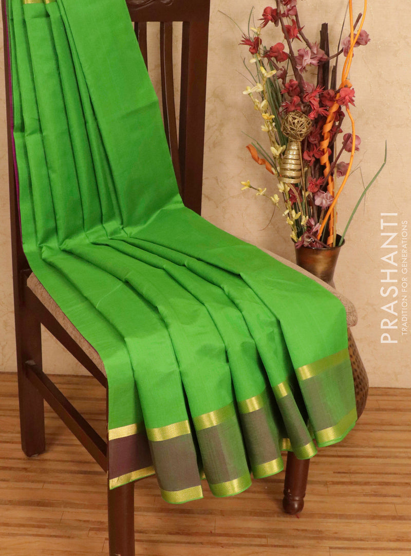 Silk cotton saree light green and magenta with plain body and rettapet zari woven border
