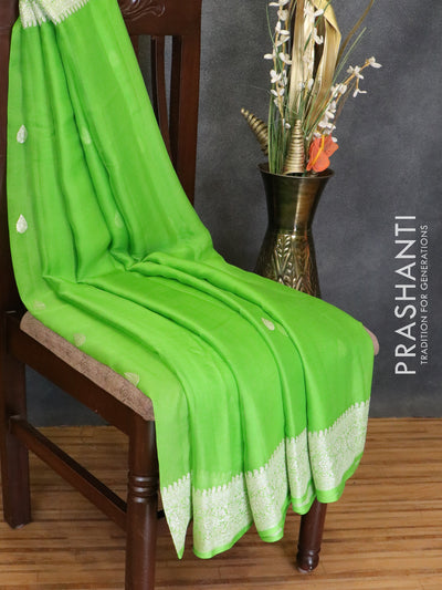 Pure chiffon saree parrot green with silver zari woven buttas and silver zari woven border