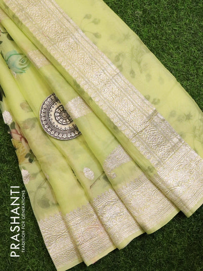 Pure chiffon saree pista green with allover floral silver zari buttas and silver zari woven border