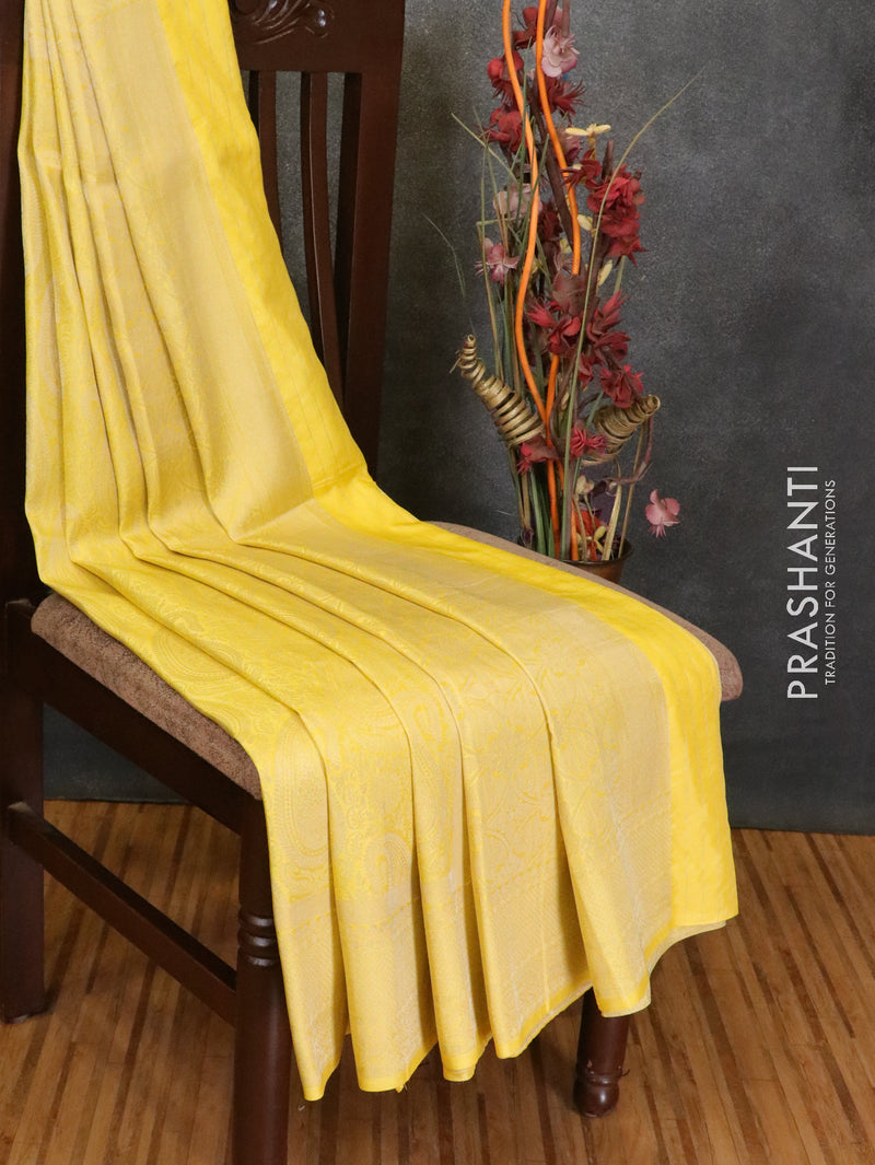 Banarasi semi silk saree yellow with allover silver zari weaves and silver zari woven border