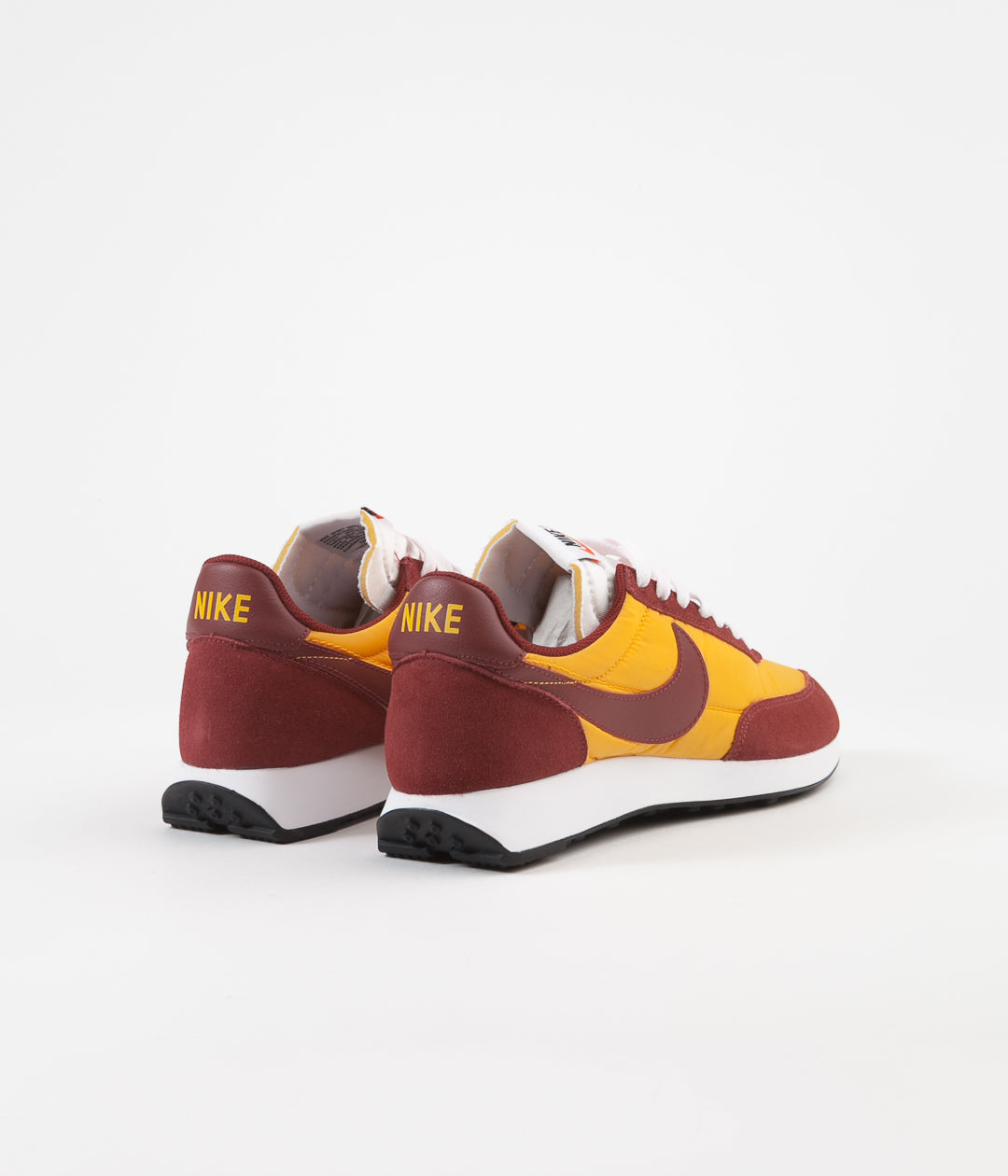 nike tailwind university gold