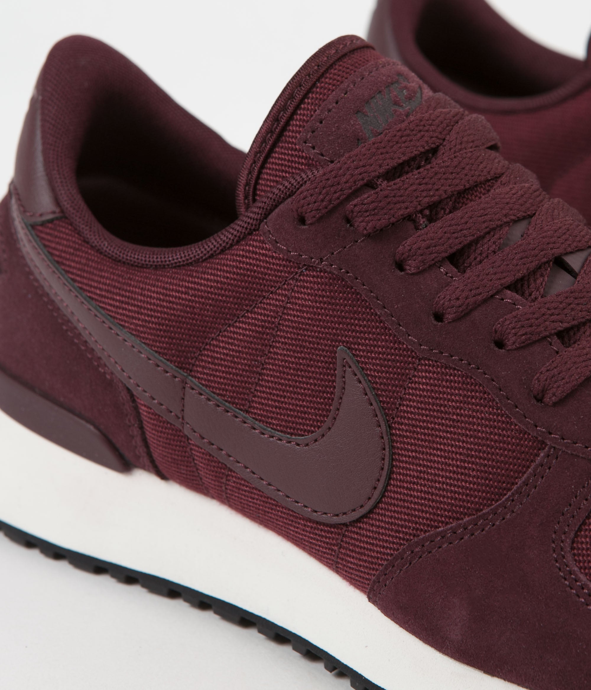 black and burgundy nike shoes