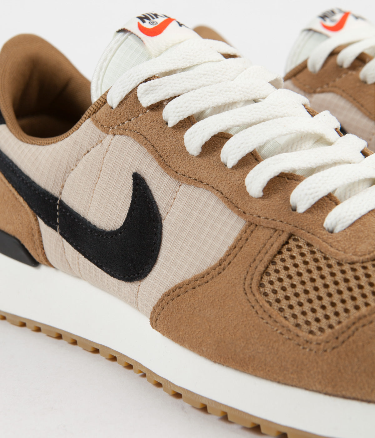 nike vortex golden beige