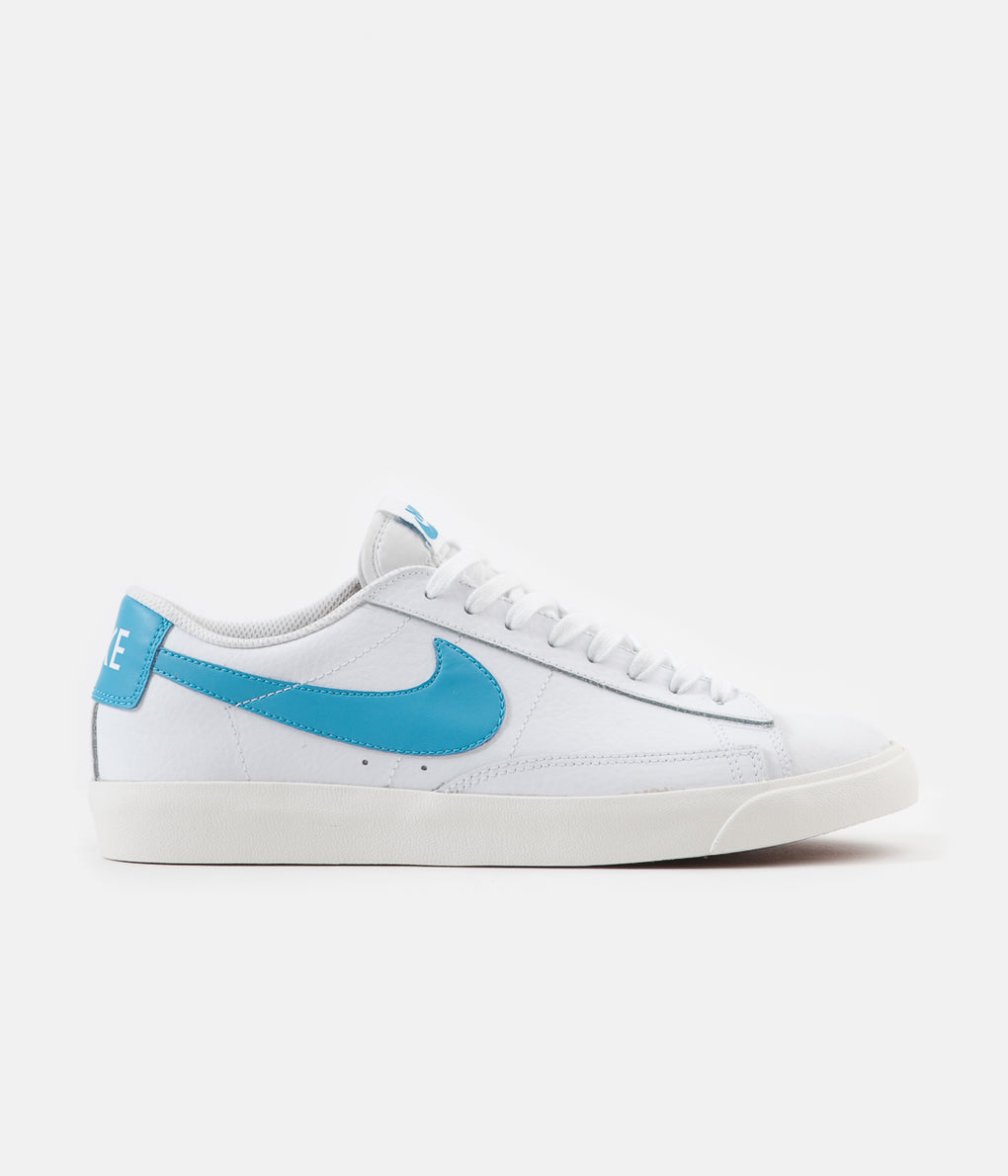 white and blue nike blazers