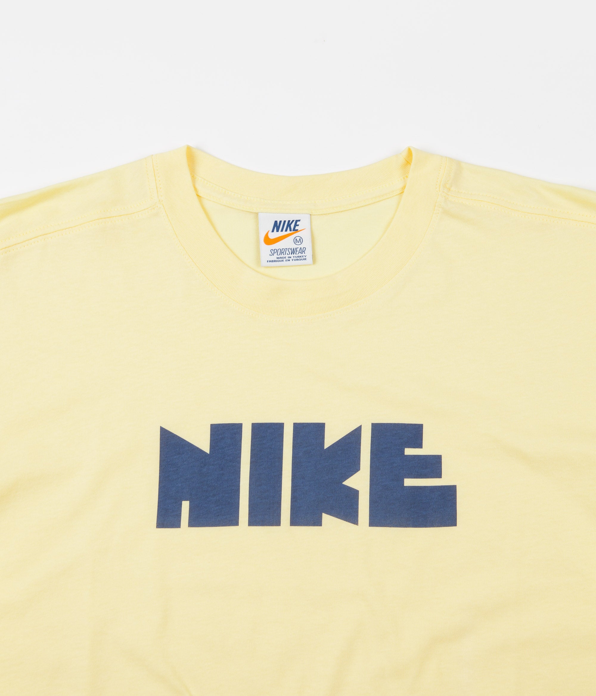 yellow nike shirt