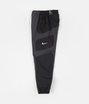 nike woven reissue pants